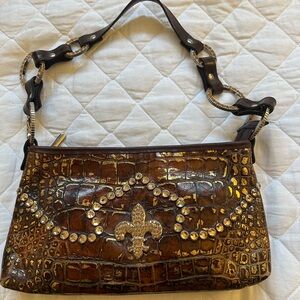 Brown Shoulder Bag with Ornate Design and Gold Embellishments